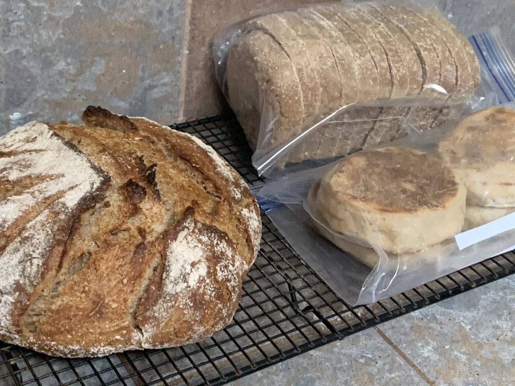Bread, loaf, and English muffins cooling.